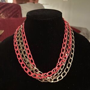 Bright coral and gold tone heavy chain necklace.